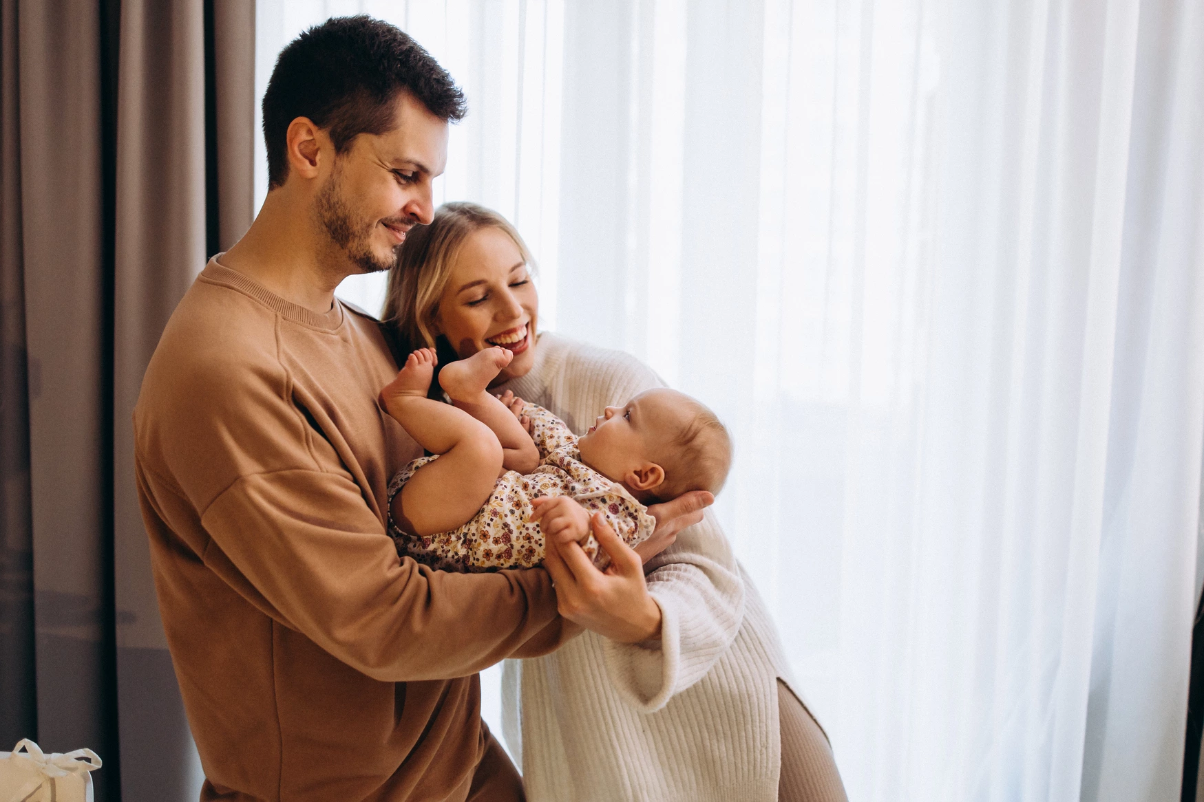 parents-holding-baby