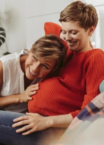 Image description Women listening to baby's heart beat