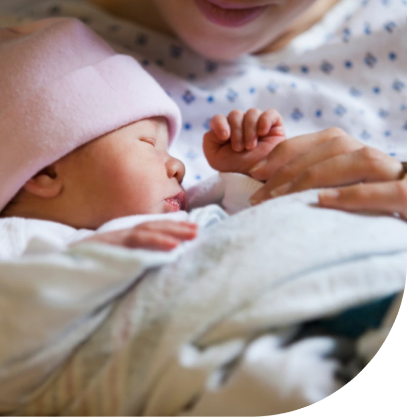 Newborn baby being held